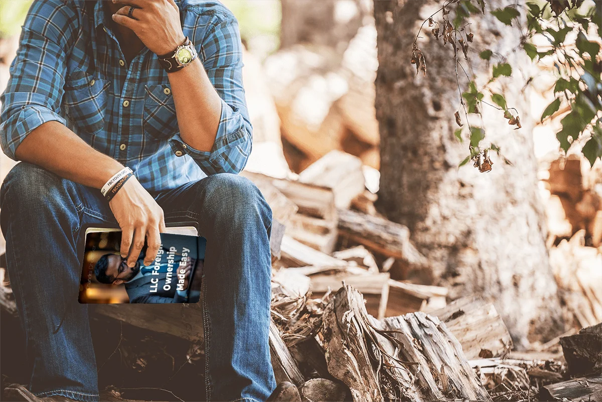Man holding LLC for Foreign Ownership Book